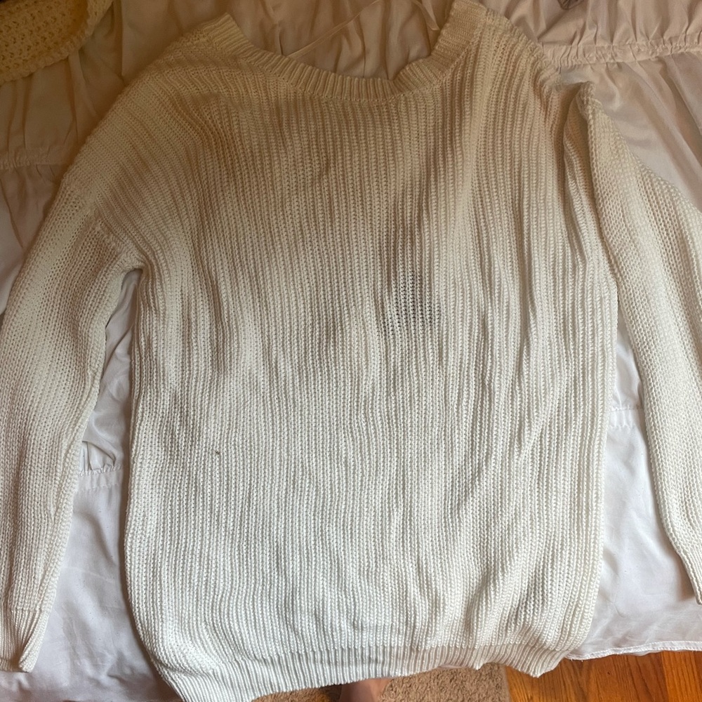 white sweater with scoop V in the back